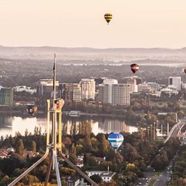 a group of people on a bridge over a body of water