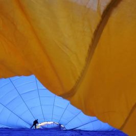 a parachute with a blue umbrella