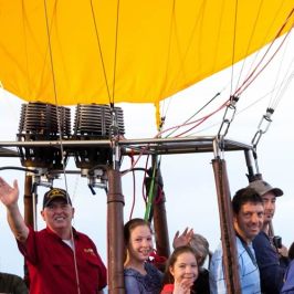 a group of people riding on the back of a boat