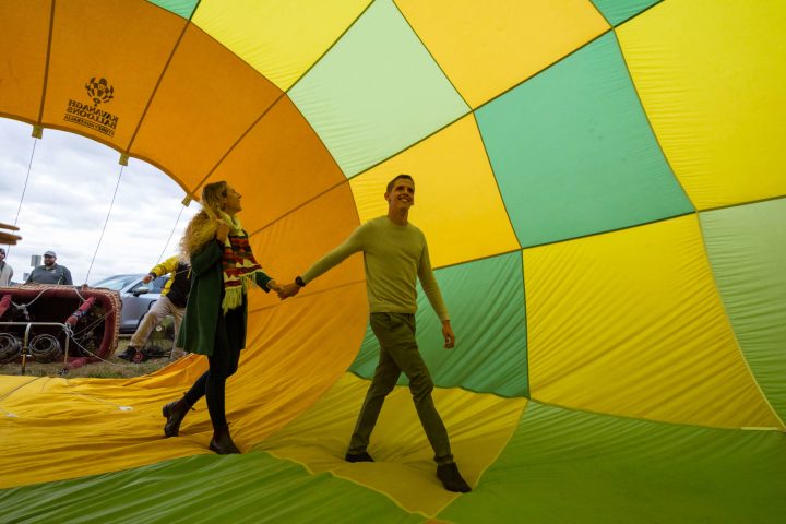 a person holding a colorful umbrella