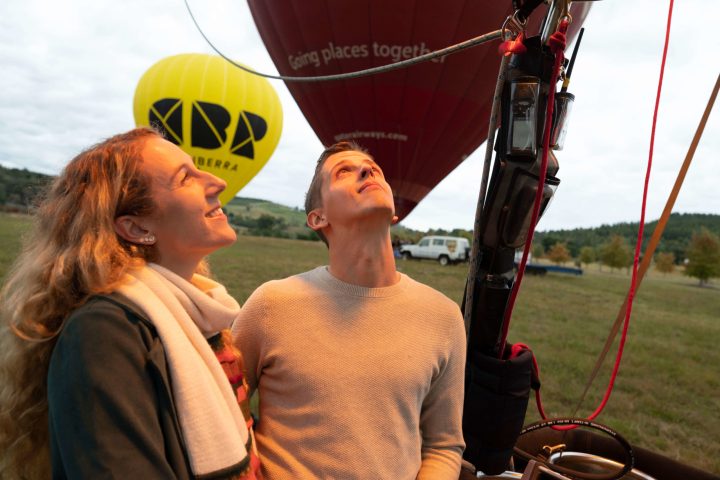 a man and a woman wearing a hat