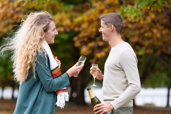 a man and a woman talking on a cell phone